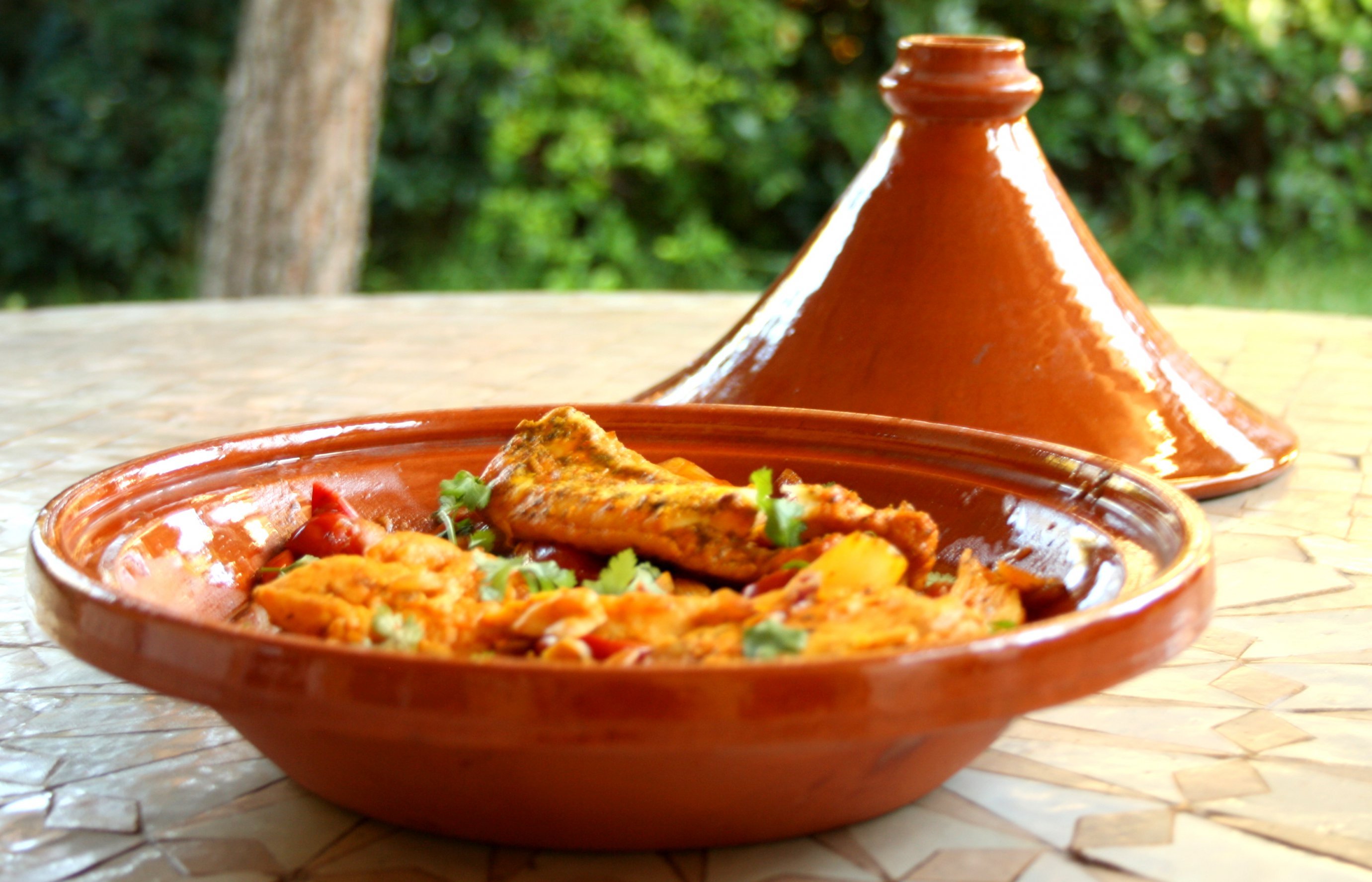 A tagine is used to cook food for longer periods at a lower temperature.