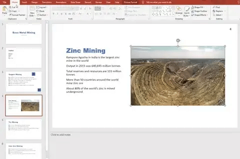 PowerPoint slide about zinc mining featuring text on the left and an open-pit mine image on the right, highlighting Rampura Agucha in India.