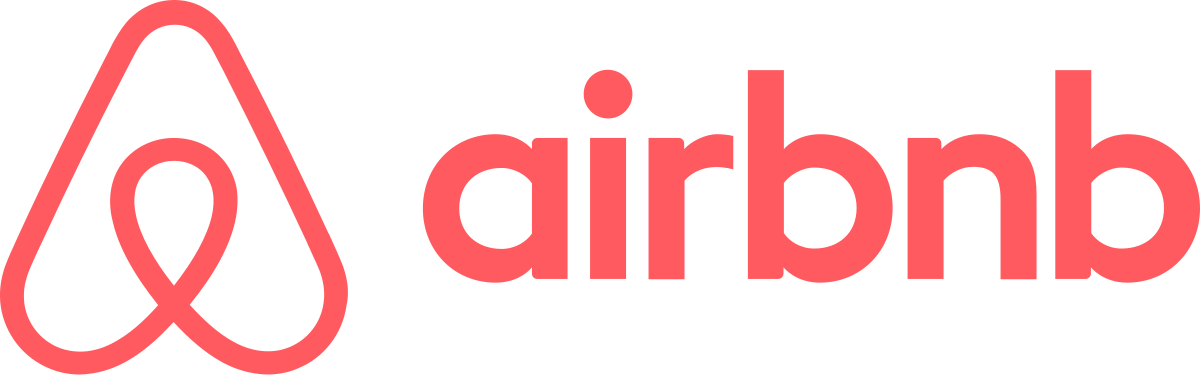 Airbnb logo featuring a stylised, pink, upside-down heart shape to the left of the lowercase word "airbnb" in pink font on a white background.