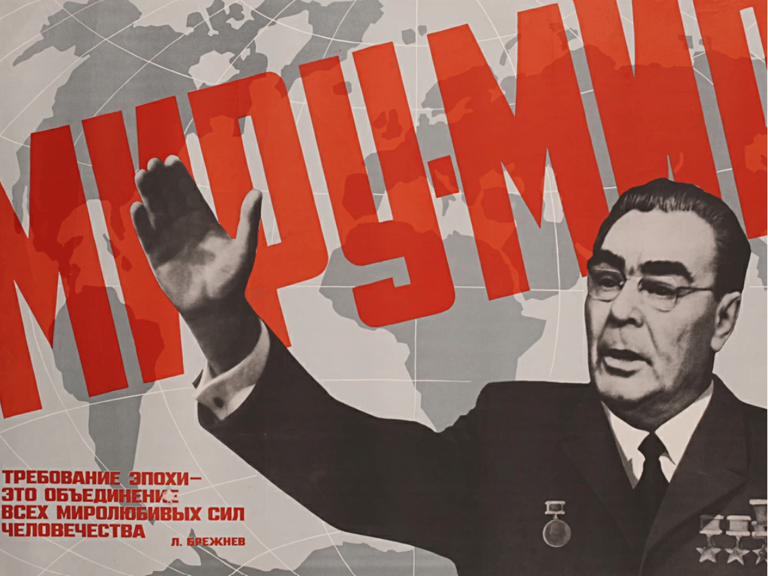 Soviet-era poster with a man in a suit raising his hand, overlaid by large red Cyrillic text and a grey world map in the background.