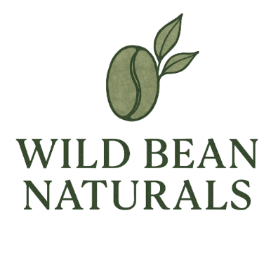 Green coffee bean with two leaves above "Wild Bean Naturals" in bold green letters, suggesting a natural product theme.