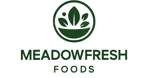 Circular logo with stylised green leaves above a curved line, representing a bowl. Below, the text reads "MEADOWFRESH FOODS" in bold green letters.