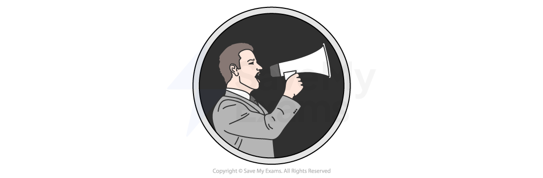 Man in a suit using a megaphone within a circular frame, against a dark background.
