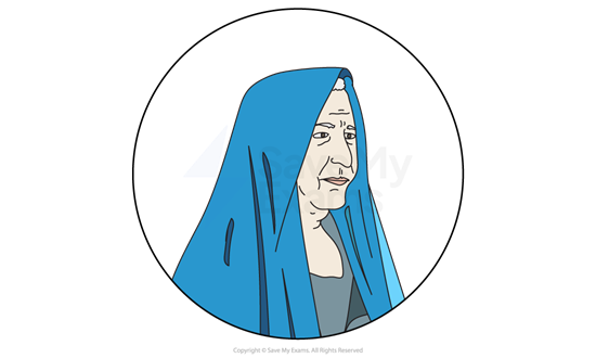 Elderly person with a serious expression wearing a blue hooded garment, set against a white background within a circular frame.