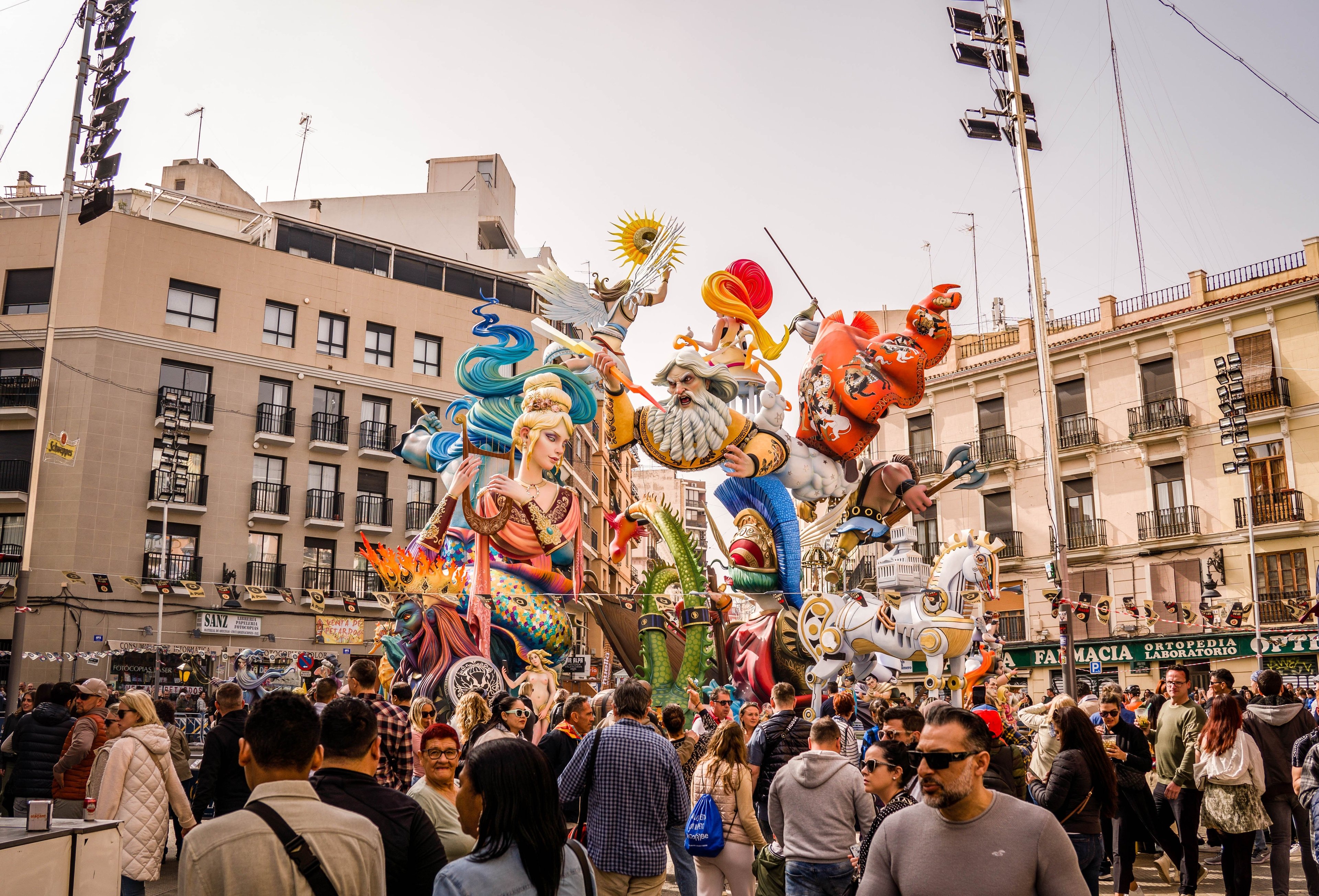 Include an image similar to the one below, which shows a multitude of people celebrating a cultural festival in Spain (las fallas). This needs to be a photo rather than an illustration.

