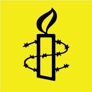 Black candle with barbed wire wrapped around it on a bright yellow background, symbolising human rights and freedom.