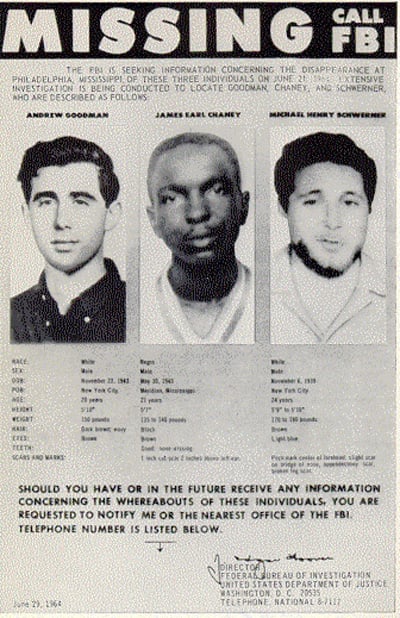 FBI missing poster featuring photos and details of three individuals: Andrew Goodman, James Earl Chaney, and Michael Henry Schwerner, seeking information.