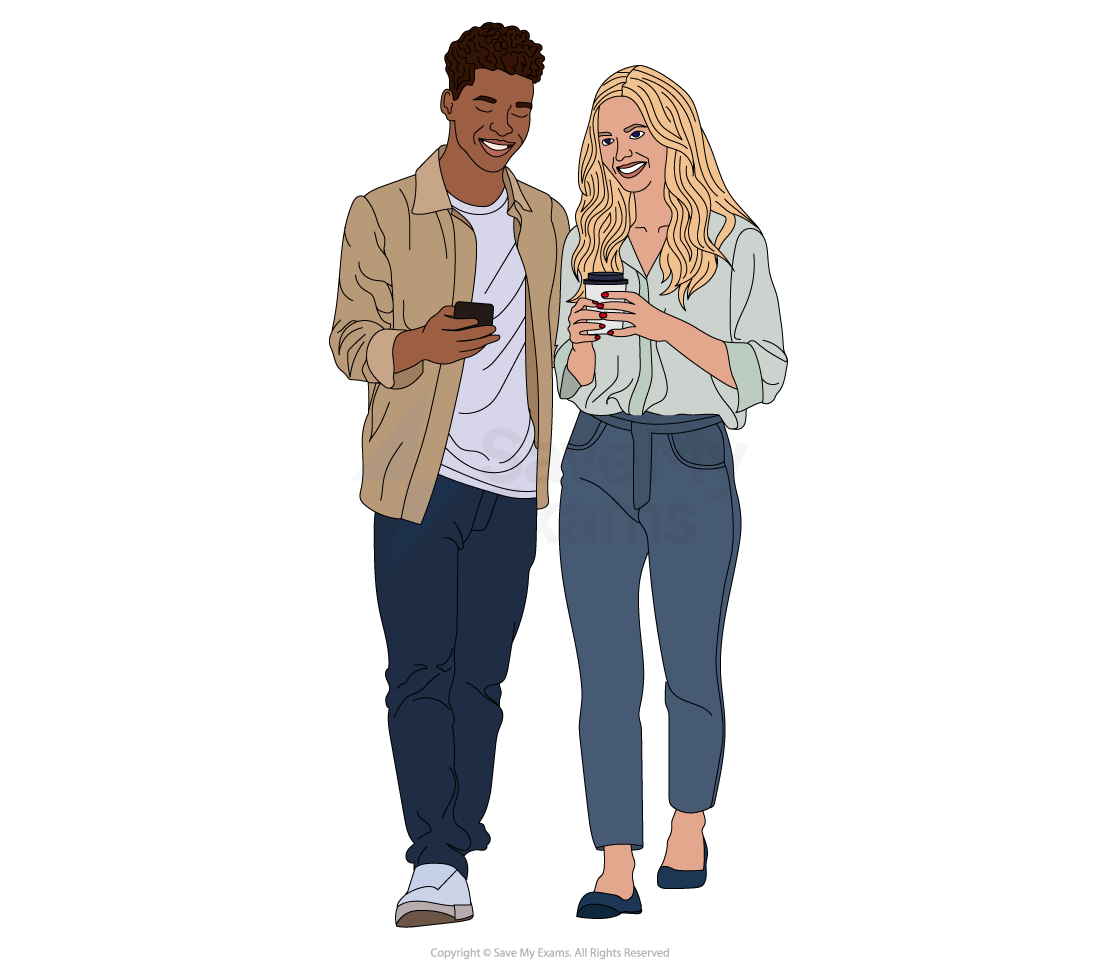 A man and woman walking while looking at their phones, smiling, wearing casual clothes with the man in a beige jacket and the woman in a light blouse.