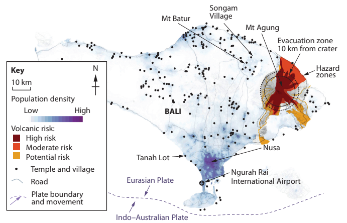 Map of Bali showing volcanic risk zones around Mt Agung, population density, temples, roads, and key locations like Ngurah Rai Airport.