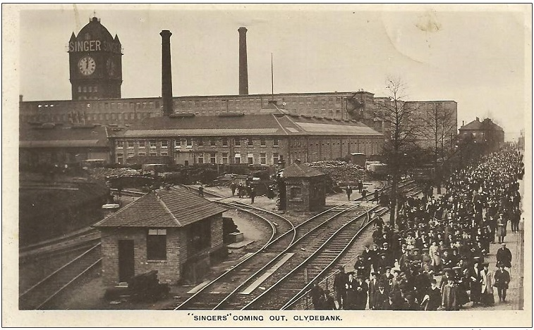 Crowd of workers leaving a factory in Clydebank, beside railway tracks and industrial buildings with a large clock tower marked "SINGER" in the background.