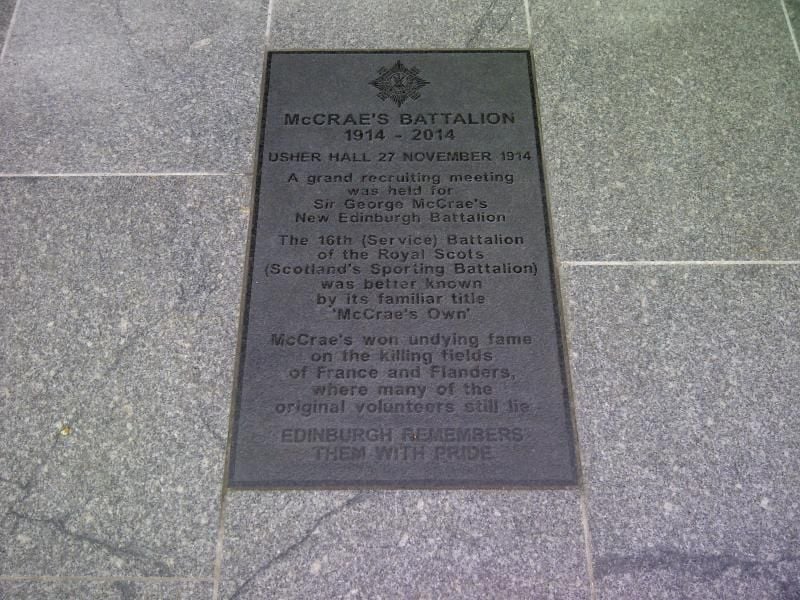 Plaque on pavement commemorating McCrae's Battalion, 1914-2014, formed after a 1914 meeting. Edinburgh remembers them with pride.
