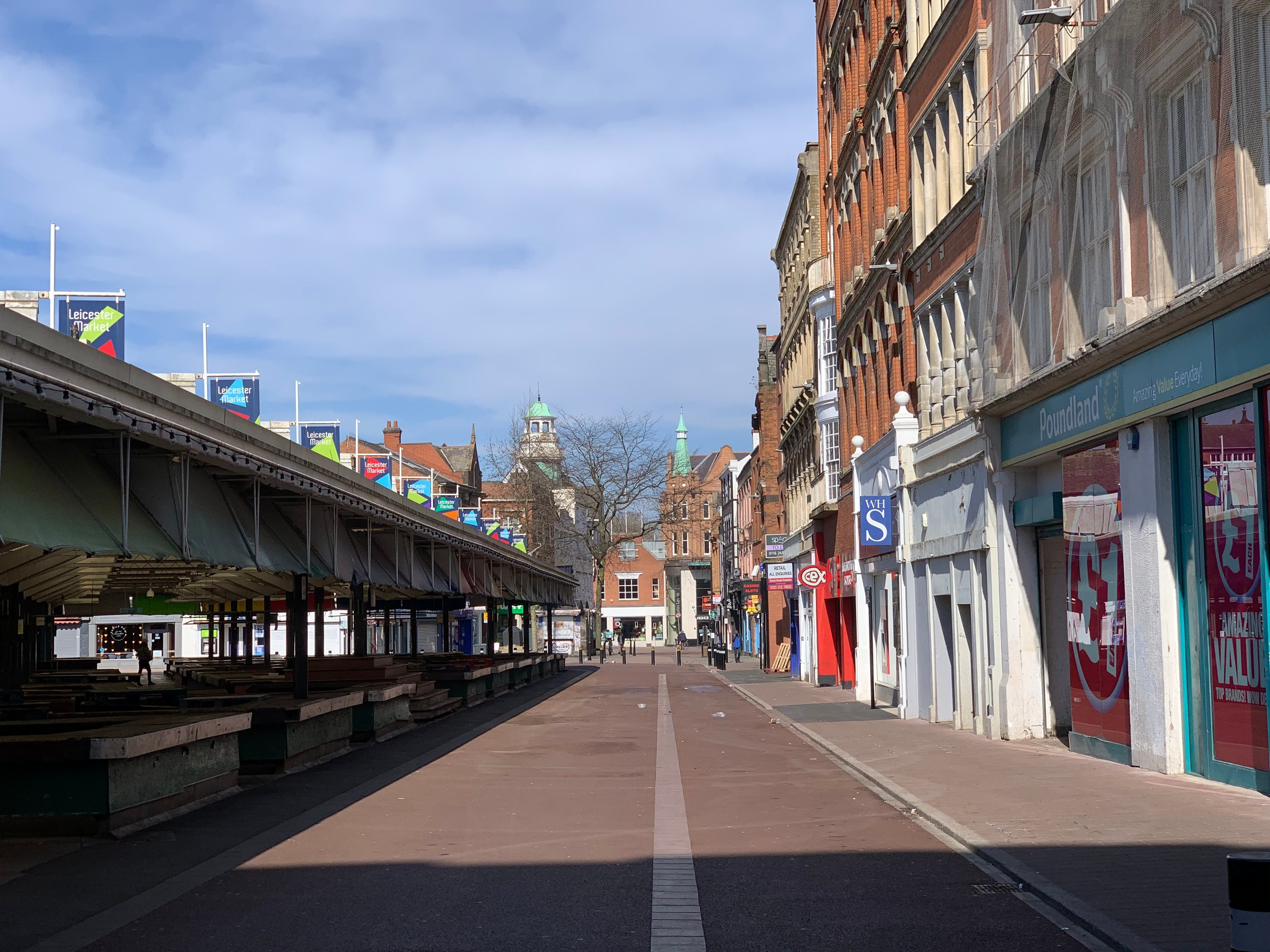 An empty shopping street and market, showing shops closed and no pedestrians, during Lockdown in 2020