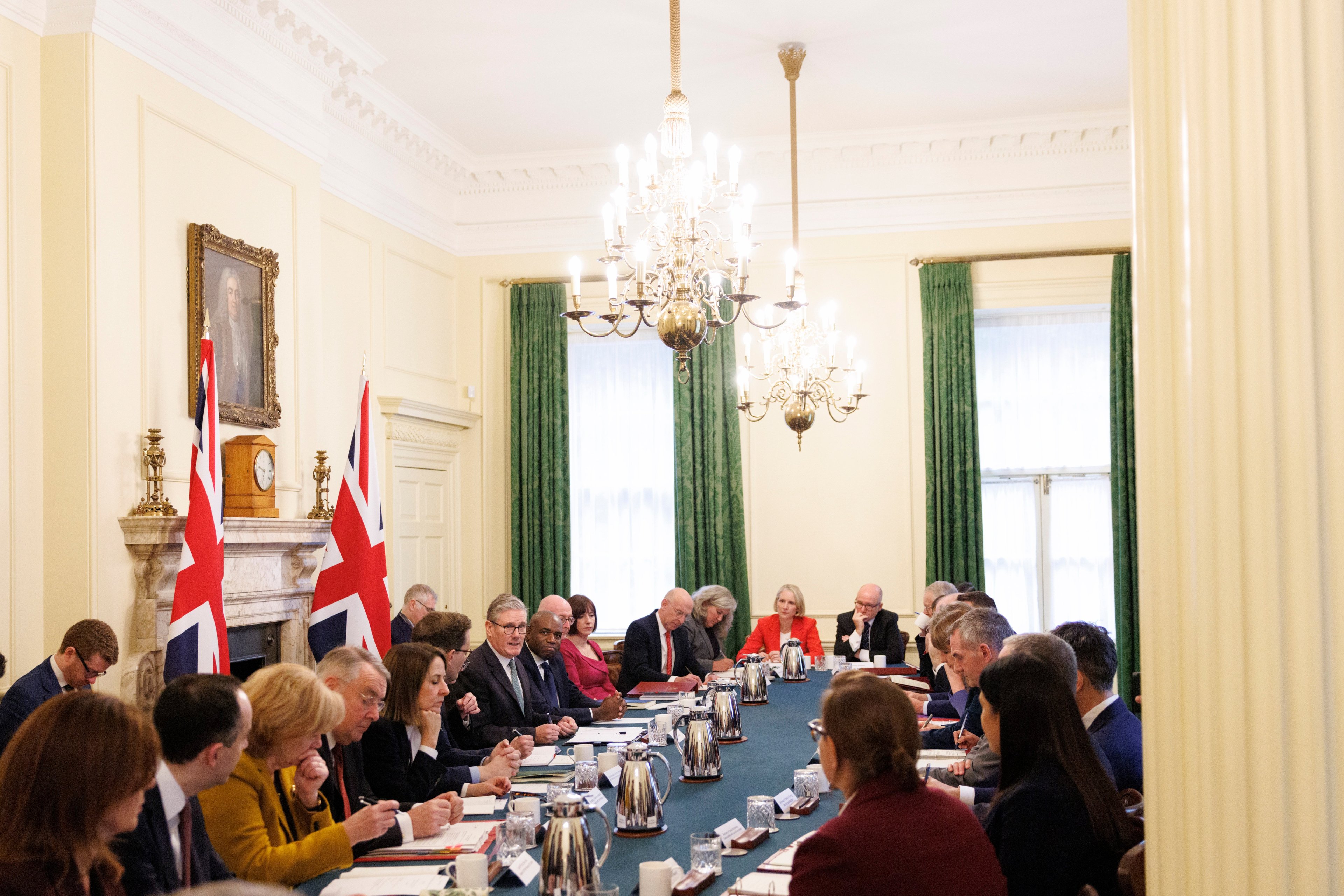 PM Keir Starmer chairs a Cabinet meeting in late 2025 - MPs sit along both sides of a long table, with large windows in the background