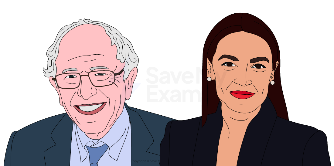 An elderly man and a young woman stand side by side holding microphones, both engaged and looking in the same direction.