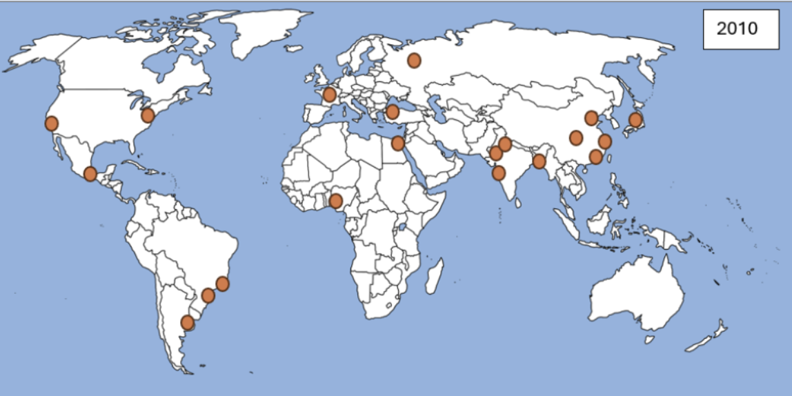 World map from 2010 with orange dots marking major cities across North and South America, Europe, and Asia.