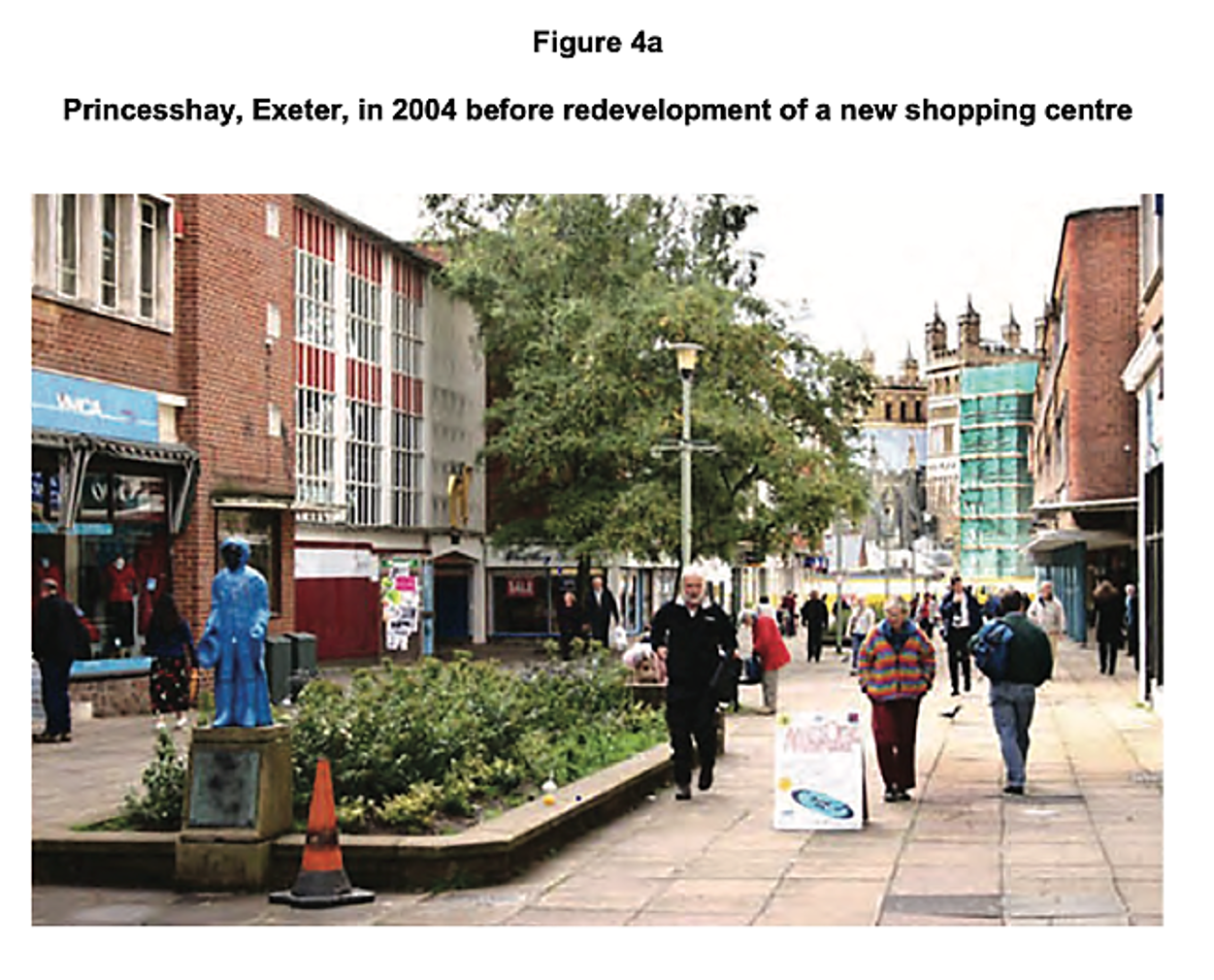 Street scene in Princesshay, Exeter, 2004, showing pedestrians, a blue statue, shops, and buildings prior to the shopping centre's redevelopment.