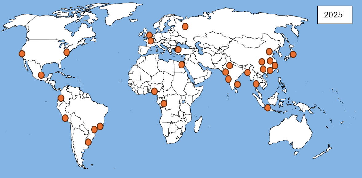 World map with orange dots marking locations across North America, South America, Europe, Africa, and Asia. Blue oceans. Labelled 2025.