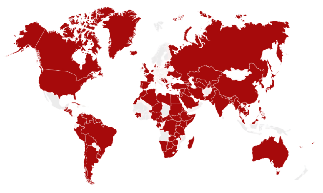 World map with most countries shaded dark red and a few in pale grey, highlighting widespread global coverage with limited unshaded regions.