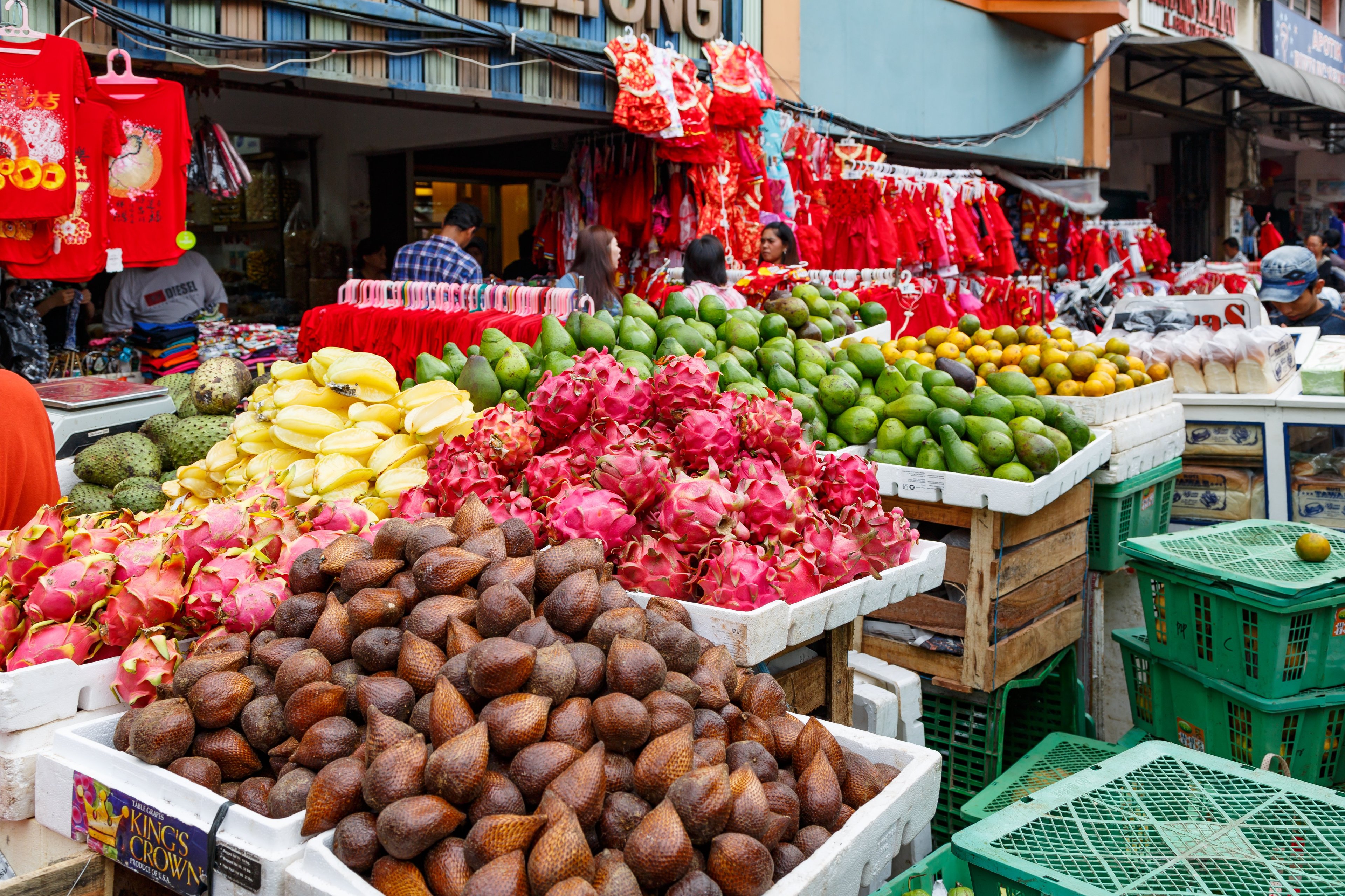 A food stall with colourful fruit and vegetables 