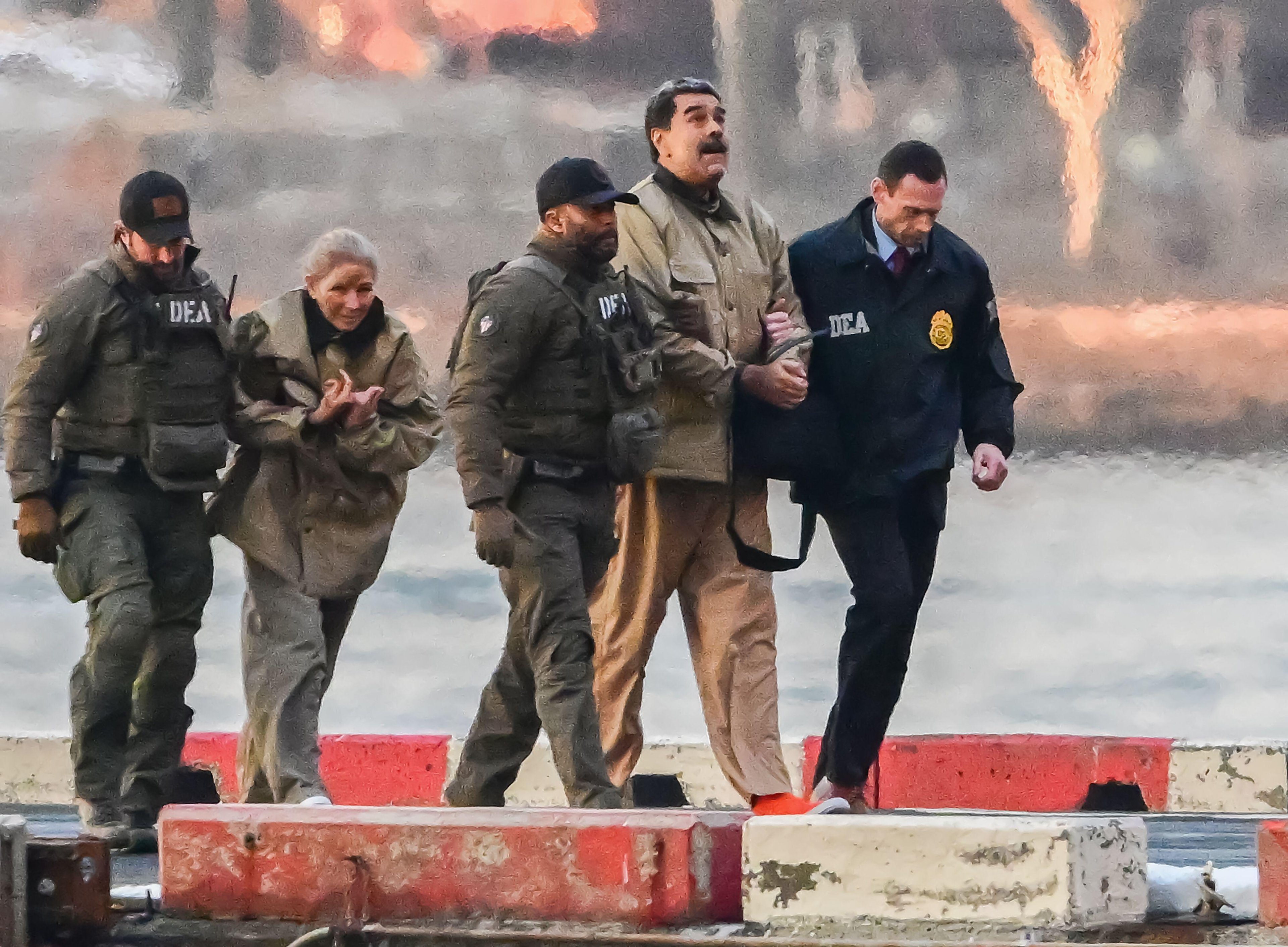 DEA officers escort two handcuffed detainees along a waterfront, the prisoners in beige clothing and orange shoes between armed agents in tactical gear