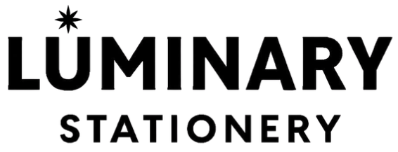 Luminary Stationery logo with bold black text and a small eight-pointed star replacing the dot above the letter U