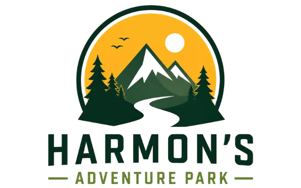 Logo for Harmon’s Adventure Park with mountains, forest, winding river, birds and sun in a yellow circle above the park name in bold green text
