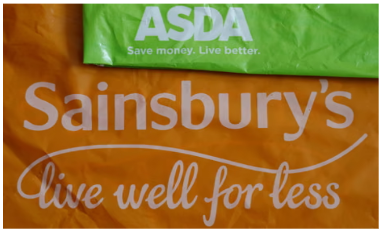 ASDA and Sainsbury’s supermarket carrier bags, green above orange, showing their logos and slogans about saving money and living well for less