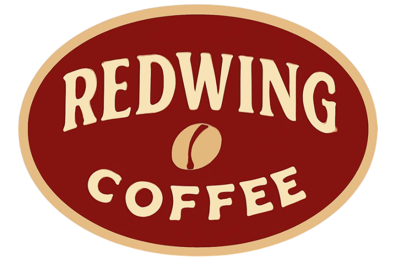 Redwing Coffee logo with cream lettering on a dark red oval background, featuring a stylised coffee bean in the centre