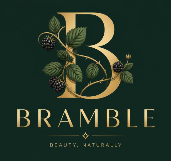 Bramble beauty brand logo with a large gold B entwined with blackberry vines on dark green, and text reading “BRAMBLE” and “Beauty, Naturally”.