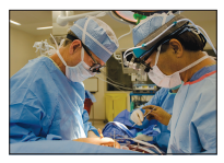 [Figure: photograph of surgeons performing heart surgery on a patient]