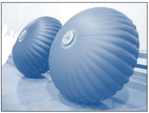 Photograph of two large, ribbed, blue plastic storage bags on the deep ocean floor, with one bag in the foreground and another behind it, illustrating proposed underwater storage of captured carbon dioxide.