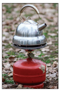Figure: Photograph of a camping stove with a pan of water being heated on it