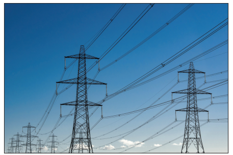 Figure: Photograph of electricity pylons carrying overhead power cables against a blue sky